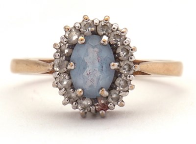 Lot 10 - A 9ct blue and white spinel ring, the oval...