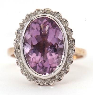 Lot 15 - A 9ct amethyst and diamond ring, the oval...