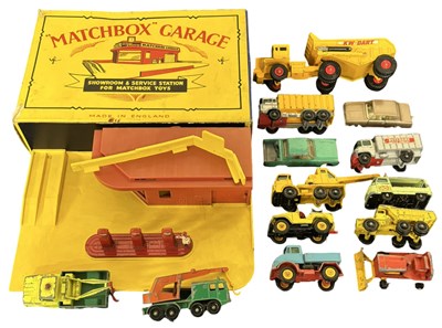 Lot 169 - A boxed Matchbox garage, together with various...