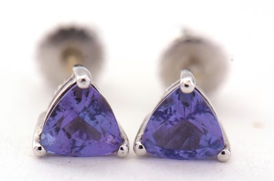 Lot 98 - A pair of 18K white gold tanzanite earrings,...