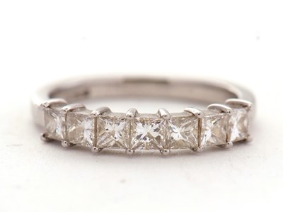 Lot 70 - A platinum seven stone diamond ring, the seven...