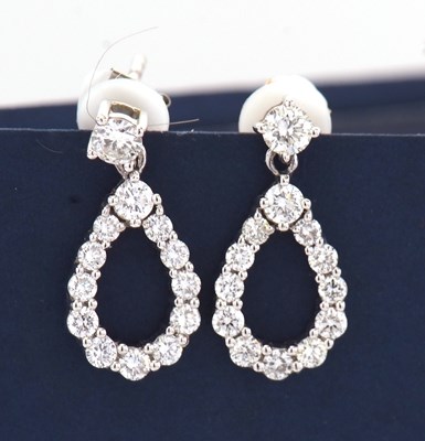 Lot 94 - A pair of 14ct white gold diamond earrings,...