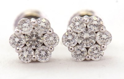 Lot 95 - A pair of platinum diamond cluster earrings,...