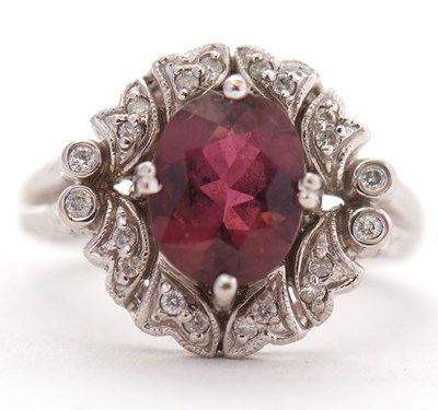 Lot 80 - A 14ct rubelite and diamond ring, the oval...
