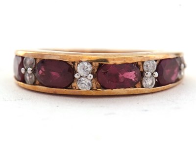 Lot 61 - A 9ct rubelite and white stone ring, with four...