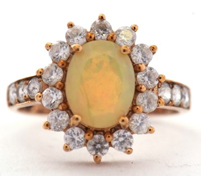Lot 78 - A 9ct opal and white stone cluster ring, set...