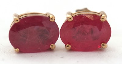 Lot 103 - A pair of ruby earstuds, the oval rubies, 8mm...
