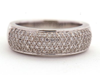 Lot 75 - An 18ct diamond ring, the upper half pave set,...