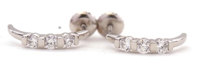 Lot 102 - A pair of platinum diamond earrings, each set...