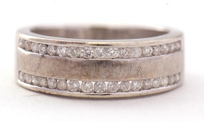 Lot 79 - A 9ct diamond ring, the 7mm wide band with two...
