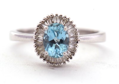 Lot 72 - An 18ct aquamarine and zircon ring, the oval...