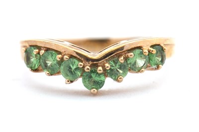Lot 25 - A 9ct green gemstone ring, the wishbone ring...