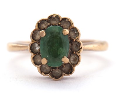 Lot 84 - A 9ct green and white stone ring, the oval...