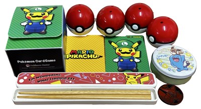 Lot 324 - POKEMON: A group of collectables, including...