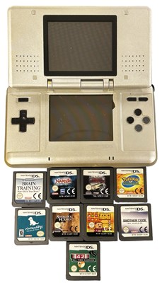 Lot 323 - A Nintendo DS handheld console, together with...