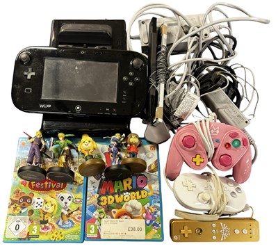 Lot 326 - A Nintendo Wii U console, together with...
