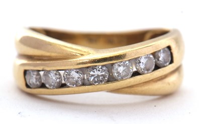Lot 21 - An 18ct diamond ring, the crossover style ring...