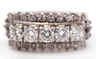 Lot 60 - A diamond ring, set with a row of five round...