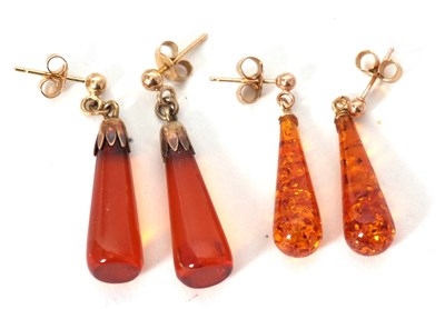 Lot 141 - Two pairs of 9ct mounted amber earrings, both...