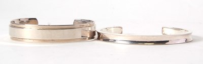Lot 188 - Two silver open ended bangles, both stamped...