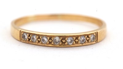 Lot 33 - An 18ct diamond ring, set with seven small...