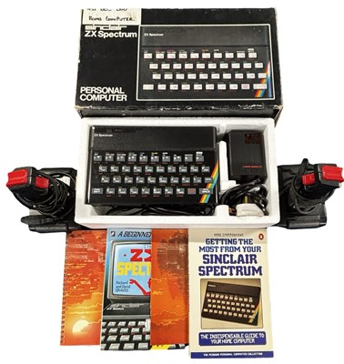 Lot 318 - A boxed Sinclair ZX Spectrum, manuals and pair...