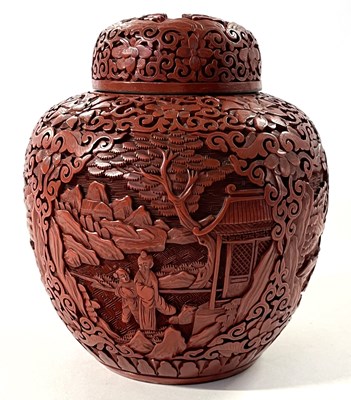 Lot 216 - A Chinese red lacquer jar and cover carved...