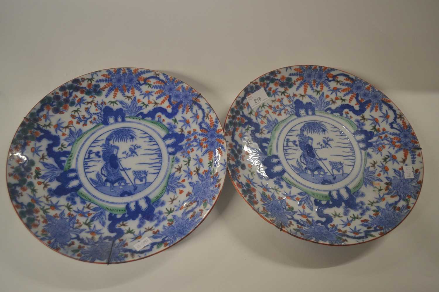 Lot 43 - A pair of Japanese porcelain chargers with...