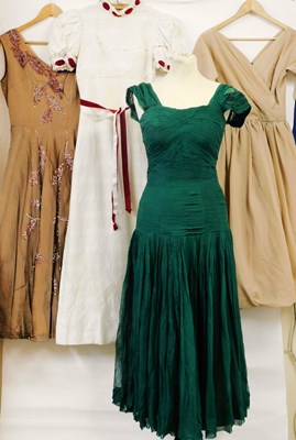 Lot 11 - Four mid 20th century dresses, to include a...