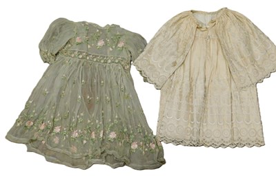 Lot 130 - Two childrens dresses, including a cream...