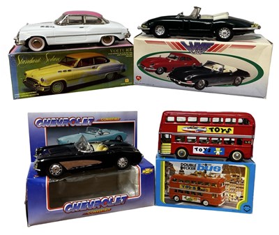 Lot 193 - Four boxed reproduction tinplate friction cars.