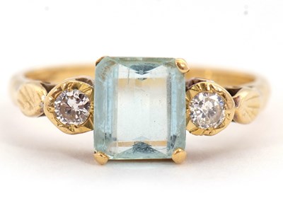 Lot 63 - An 18ct aquamarine and diamond ring, the...