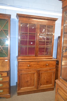 Lot 455 - A George III mahogany secretaire bookcase...