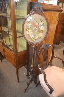 Lot 469 - A Victorian pole screen, the oval needlework...