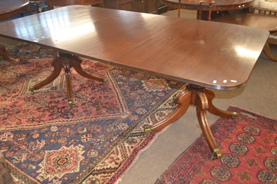Lot 589 - A mahogany twin pedestal dining table with...
