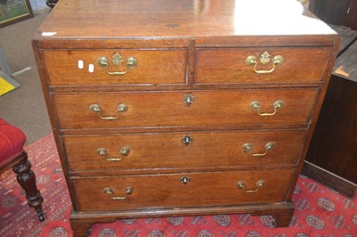 Lot 506 - A George III oak chest of drawers with two...