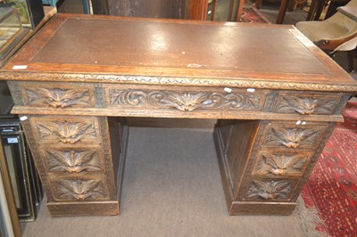 Lot 507 - A Victorian Gothic oak pedestal desk of nine...
