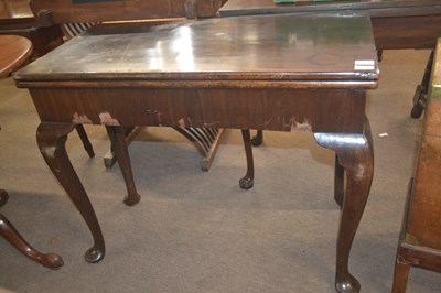 Lot 428 - A Georgian mahogany games table of hinged...