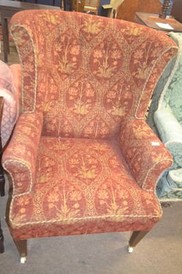 Lot 369 - A late 19th Century wing back armchair with...