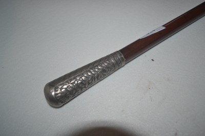 Lot 614 - An Indian white metal mounted walking cane the...