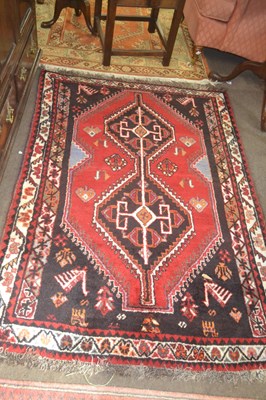 Lot 626 - A modern Middle Eastern wool floor rug...