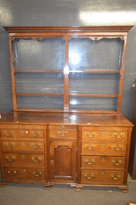 Lot 387 - A large George III oak mule chest with hinged...