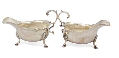Lot 257 - Two George III silver sauce boats of typical...