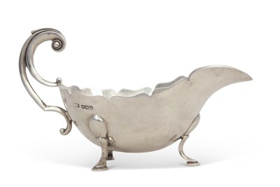 Lot 259 - A George V silver sauce boat of typical form...