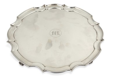 Lot 318 - An Edwardian silver salver of shaped circular...