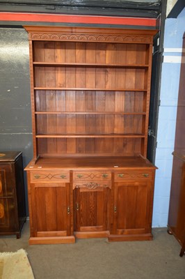 Lot 433 - A 20th Century cherry wood kitchen dresser...