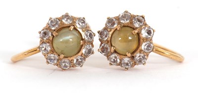 Lot 170 - A pair of cats eye chrysoberyl and white stone...