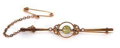 Lot 169 - A 9ct peridot and seed pearl brooch, with...