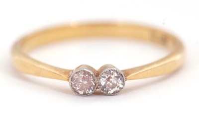 Lot 59 - A two stone diamond ring, set with two old...