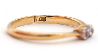 Lot 59 - A two stone diamond ring, set with two old...